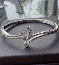 Load image into Gallery viewer, Four Teardrop Hinged Crossover Silver Bangle with Clear CZ stones
